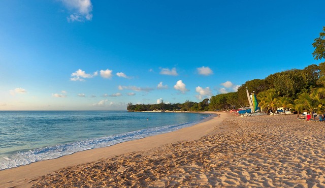 Commanding views of the verdant fairway and the Caribbean Sea beyond, is Casuarina House