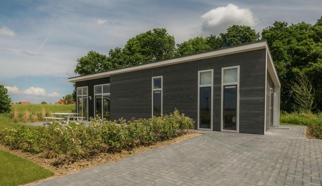 Modern chalet at the edge of a forest near the Oosterschelde in Wemeldinge