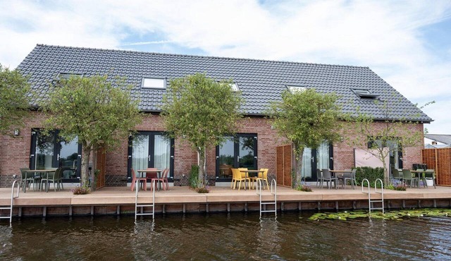 Semi-detached 5-person holiday home on the waterfront in Roelofarendsveen