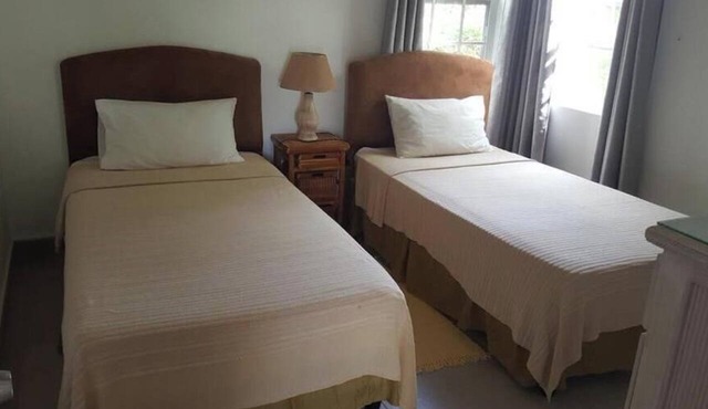 Shades Apt 2 – Comfortable Two-Bedroom Garden Apartment with Pool Access