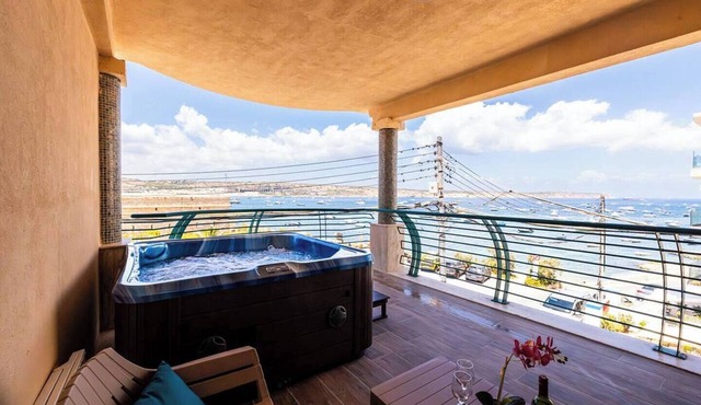 Wake up to beautiful Mediterranean views in this stylish three-bedroom seafront apartment in Għadira Bay, Mellieħa. Enjoy three double bedrooms, modern interiors, excellent facilities and a private jacuzzi overlooking the bay. in Il-Mellieħa